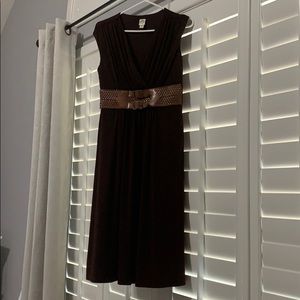 Mid length brown dress.
